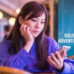 woman looking at phone thinking